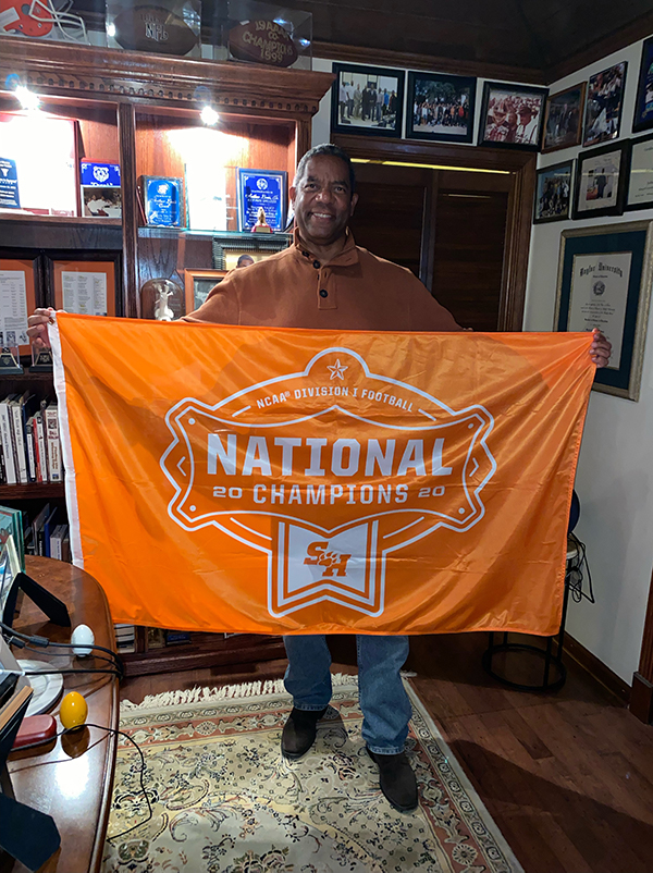 Louis with national championship flag